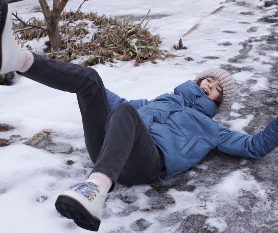 woman slips and falls on icy sidewalk