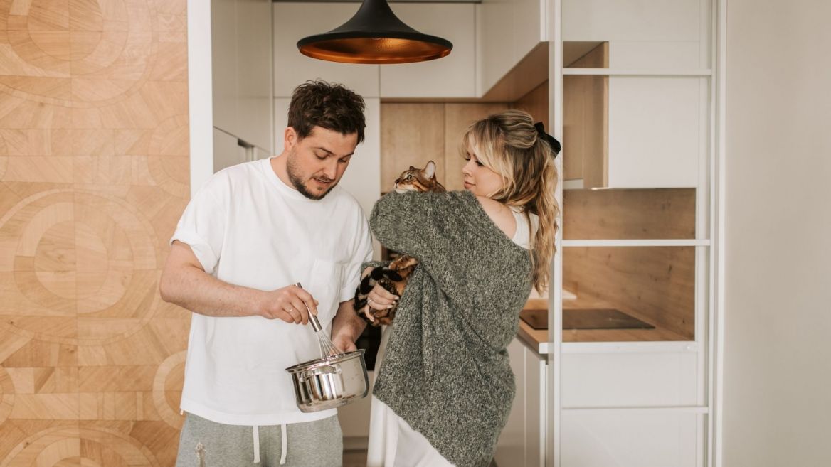 young couple with cat